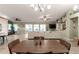 Open floorplan of the living room showing views through large windows to the backyard and pool at 950 W Cooley Dr, Gilbert, AZ 85233
