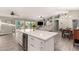 Open concept living and dining area with ample natural light and views to backyard at 950 W Cooley Dr, Gilbert, AZ 85233