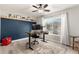 This office features wood floors, large windows, and a monitor setup for remote work at 950 W Cooley Dr, Gilbert, AZ 85233