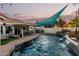 Backyard with a pool and outdoor kitchen offers an ideal space for entertainment at 950 W Cooley Dr, Gilbert, AZ 85233