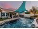 Backyard with a pool and outdoor kitchen offers an ideal space for entertainment at 950 W Cooley Dr, Gilbert, AZ 85233