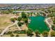 Aerial showing the green lake, gazebo, and recreational space providing a scenic community at 9960 E Strobe Ave, Mesa, AZ 85212