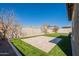 A beautiful backyard featuring manicured artificial turf and a stone patio at 9960 E Strobe Ave, Mesa, AZ 85212