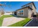 Backyard with an inset trampoline, artificial turf, patio and covered area at 9960 E Strobe Ave, Mesa, AZ 85212