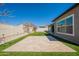 An inviting backyard featuring a well-maintained lawn and a paved patio area at 9960 E Strobe Ave, Mesa, AZ 85212