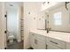 Bright bathroom featuring a white vanity with a sleek sink and modern black fixtures at 9960 E Strobe Ave, Mesa, AZ 85212