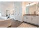 Contemporary bathroom featuring double sinks, a modern glass-enclosed shower, and modern fixtures at 9960 E Strobe Ave, Mesa, AZ 85212