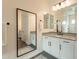 Stylish bathroom with double sinks, a large mirror, and modern fixtures at 9960 E Strobe Ave, Mesa, AZ 85212