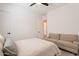 Relaxing bedroom with neutral colors, carpeted floors, and a cozy sofa at 9960 E Strobe Ave, Mesa, AZ 85212