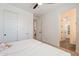 Bright bedroom offering ample closet space and featuring a neutral color scheme and a ceiling fan for comfort at 9960 E Strobe Ave, Mesa, AZ 85212