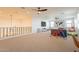 Open bonus room with a play area, media space, and large windows for natural light at 9960 E Strobe Ave, Mesa, AZ 85212