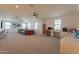 Large bonus room featuring a play area, office, comfortable sofa, and ample natural light at 9960 E Strobe Ave, Mesa, AZ 85212