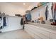 Organized walk-in closet featuring custom drawers and shelving for ample storage at 9960 E Strobe Ave, Mesa, AZ 85212