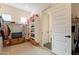 Bright walk-in closet with custom shelving, hanging racks, and natural light at 9960 E Strobe Ave, Mesa, AZ 85212