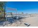 Scenic view of Steadfast Farm at Eastmark, featuring rows of crops and covered greenhouses against a clear blue sky at 9960 E Strobe Ave, Mesa, AZ 85212
