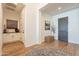 Bright foyer with hardwood floors, stylish rug, and a view of elegant decor and a paneled front door at 9960 E Strobe Ave, Mesa, AZ 85212