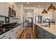 Stylish kitchen featuring stainless steel appliances, sleek countertops, and ample cabinet storage at 9960 E Strobe Ave, Mesa, AZ 85212