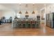 Bright kitchen with a large center island, pendant lighting, and stainless steel appliances at 9960 E Strobe Ave, Mesa, AZ 85212
