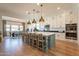 Spacious kitchen featuring a large island with seating, modern appliances, and ample cabinet space at 9960 E Strobe Ave, Mesa, AZ 85212