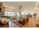 Open-concept living room with patio access and comfortable seating arrangements create a warm, inviting space at 9960 E Strobe Ave, Mesa, AZ 85212