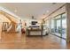 Spacious living room with a spiral staircase, neutral furniture, and large sliding doors to the outdoor space at 9960 E Strobe Ave, Mesa, AZ 85212