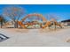 Vibrant orange play structure at the community playground, providing a fun and engaging space for children to explore at 9960 E Strobe Ave, Mesa, AZ 85212