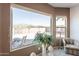 The main bedroom has a large window with a great view of the back patio and mountains beyond the privacy wall at 10368 E Gold Nugget Ct, Gold Canyon, AZ 85118