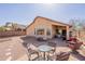 The backyard features a patio with outdoor seating, a desert landscape, and mountain views at 10368 E Gold Nugget Ct, Gold Canyon, AZ 85118