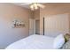 This bedroom features a ceiling fan, closet with doors and a doorway to the attached bathroom at 10368 E Gold Nugget Ct, Gold Canyon, AZ 85118