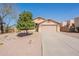 Charming single-story home with a two car garage, low maintenance landscaping, and a private driveway at 10368 E Gold Nugget Ct, Gold Canyon, AZ 85118
