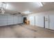 Spacious garage featuring ample storage, workbench, refrigerators and an automatic door opener at 10368 E Gold Nugget Ct, Gold Canyon, AZ 85118