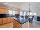 Spacious kitchen featuring an island, lots of cabinets, and adjacent breakfast area at 10368 E Gold Nugget Ct, Gold Canyon, AZ 85118