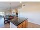 Open kitchen with island flows into dining area and living room, perfect for entertaining at 10368 E Gold Nugget Ct, Gold Canyon, AZ 85118