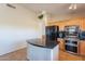 Bright kitchen features an island, stainless steel appliances, and ample counter space at 10368 E Gold Nugget Ct, Gold Canyon, AZ 85118