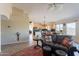 Spacious living room with an open-concept view into the kitchen and dining area at 10368 E Gold Nugget Ct, Gold Canyon, AZ 85118