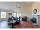 Comfortable living room has lots of seating, a fireplace, and access to the patio at 10368 E Gold Nugget Ct, Gold Canyon, AZ 85118