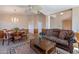 Open living area with a ceiling fan, dining space with chandelier, and a seamless flow for modern living at 10368 E Gold Nugget Ct, Gold Canyon, AZ 85118