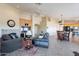 Open-concept living area shows fireplace, TV, and views into dining area and kitchen at 10368 E Gold Nugget Ct, Gold Canyon, AZ 85118