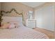 Cozy bedroom featuring a plush bed, floral accents, and white dresser at 10421 W Via Del Sol -- # 379, Peoria, AZ 85383