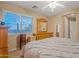 Comfortable bedroom featuring wooden furniture and a large window with a view at 10421 W Via Del Sol -- # 379, Peoria, AZ 85383