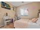 Bedroom with a soft chunky knit blanket, vanity, and decor at 10421 W Via Del Sol -- # 379, Peoria, AZ 85383