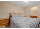 Bedroom with a wooden bed frame and access to an ensuite bathroom at 10421 W Via Del Sol -- # 379, Peoria, AZ 85383