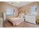 Cozy bedroom with natural light, featuring a comfortable bed, and a charming decorative theme at 10421 W Via Del Sol -- # 379, Peoria, AZ 85383