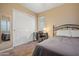 Bedroom with a bed, desk and sliding-door closet at 10421 W Via Del Sol -- # 379, Peoria, AZ 85383