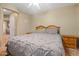Bright bedroom with a large bed, wooden furniture, and ample natural light at 10421 W Via Del Sol -- # 379, Peoria, AZ 85383