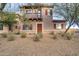 Charming two-story home featuring a quaint balcony, decorative shutters, and well-kept front yard at 10421 W Via Del Sol -- # 379, Peoria, AZ 85383