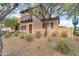 Two story home featuring a charming front patio and desert landscaping at 10421 W Via Del Sol -- # 379, Peoria, AZ 85383