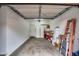 Cluttered garage with a ladder, boxes, and other items, showing plenty of storage space at 10421 W Via Del Sol -- # 379, Peoria, AZ 85383