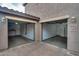 Two-car garage with open doors offering ample space for parking and storage, as well as a convenient workspace at 10421 W Via Del Sol -- # 379, Peoria, AZ 85383
