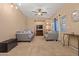 Comfortable living room with plush sofas, ceiling fan, and a view of the window at 10421 W Via Del Sol -- # 379, Peoria, AZ 85383